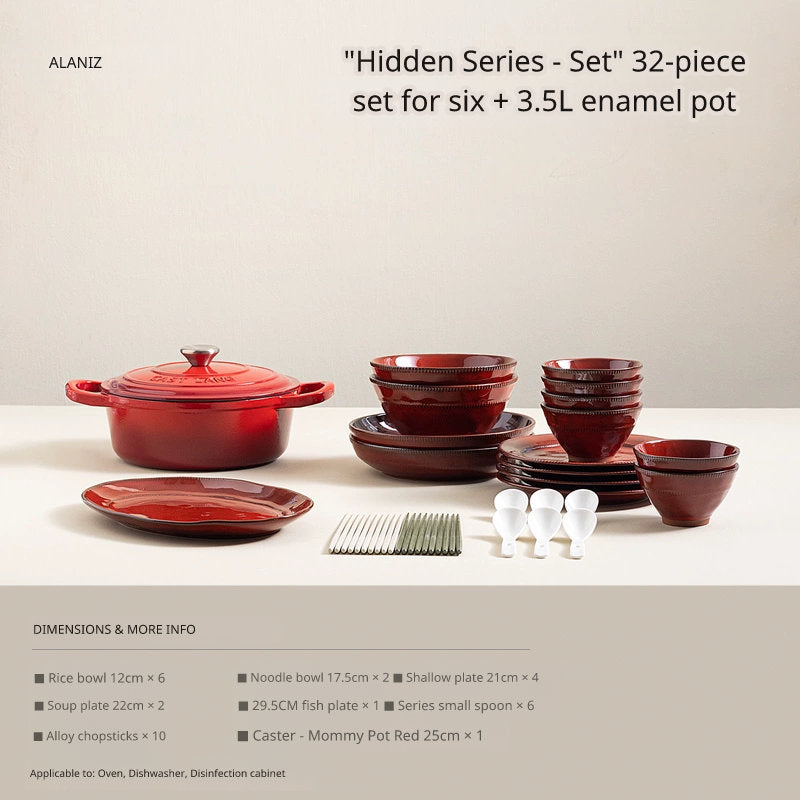 A red Dutch oven sits next to stacks of red bowls and plates, with chopsticks and small white condiment dishes arranged in front.