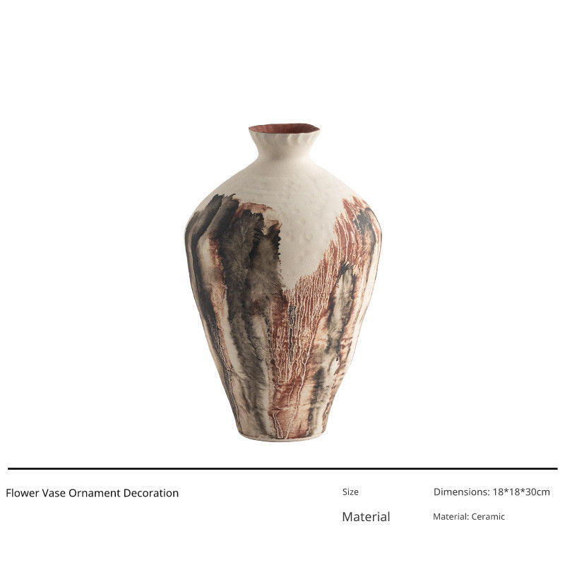 A tall, beige ceramic vase with a narrow neck and a wide body decorated with abstract, flowing brown and black patterns.