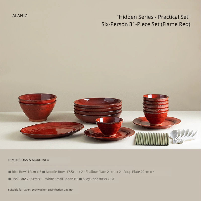 A set of glossy red ceramic tableware, including stacked bowls, plates, and soup bowls, arranged on a white surface.