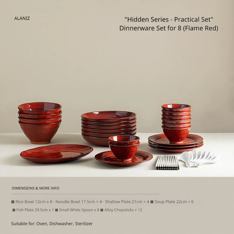 A collection of red ceramic dinnerware, including bowls, plates, and spoons, arranged on a white surface.