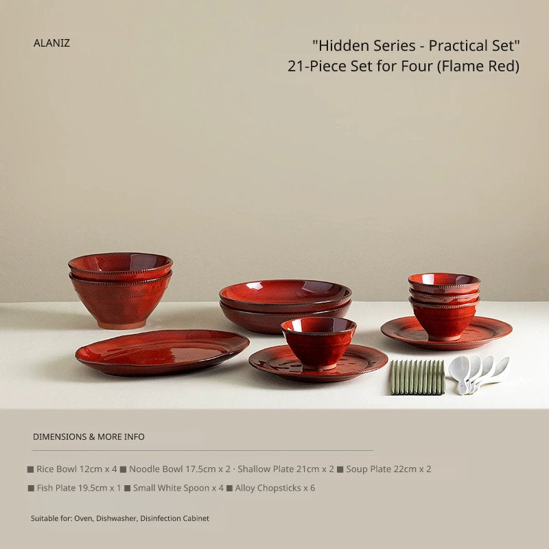 A collection of rustic, red ceramic dishes and bowls arranged on a clean surface, with white spoons and a utensil holder to the side.