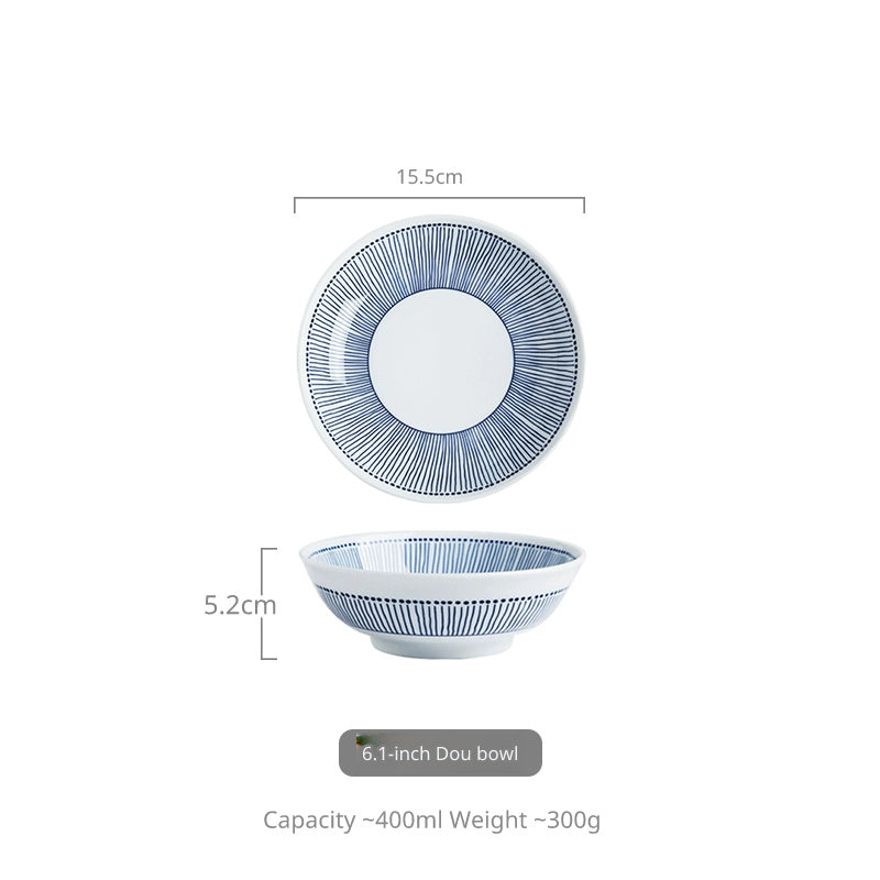 A top-down view and side view of a white ceramic bowl with a blue striped pattern.