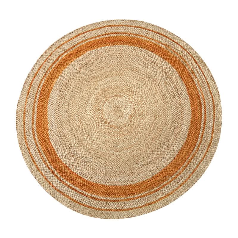 Round jute rug with natural weave and orange stripes, perfect for home decor.