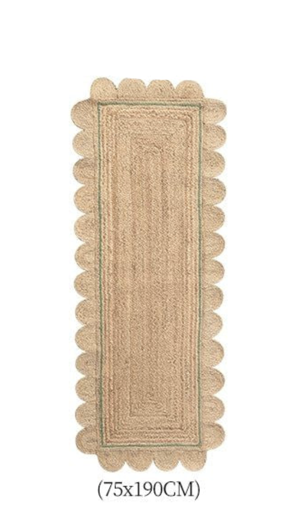 Natural jute scalloped rug with green trim, 75x190cm.