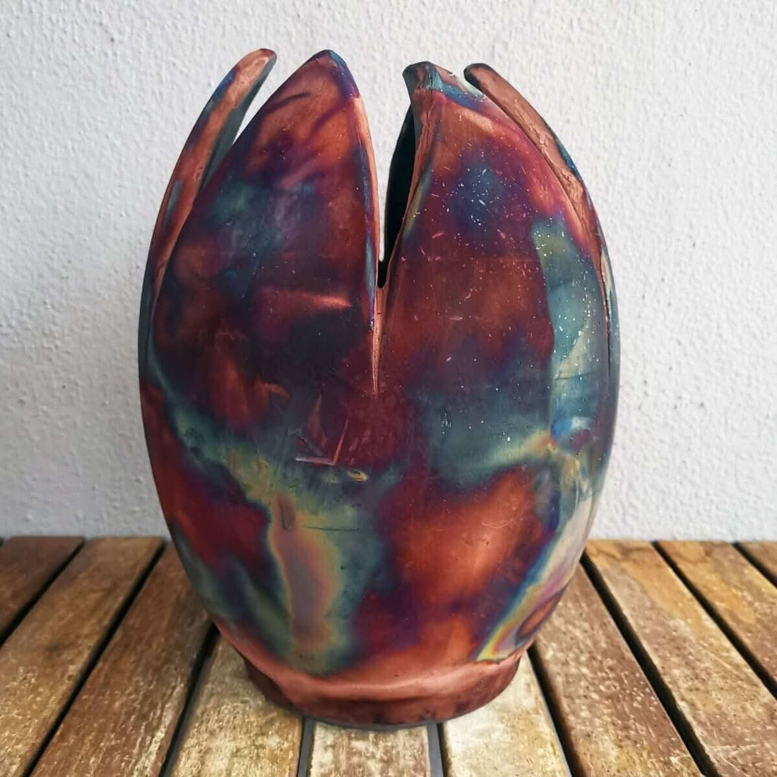 RAAQUU flower vase, vibrant copper-toned ceramic, tulip shape.