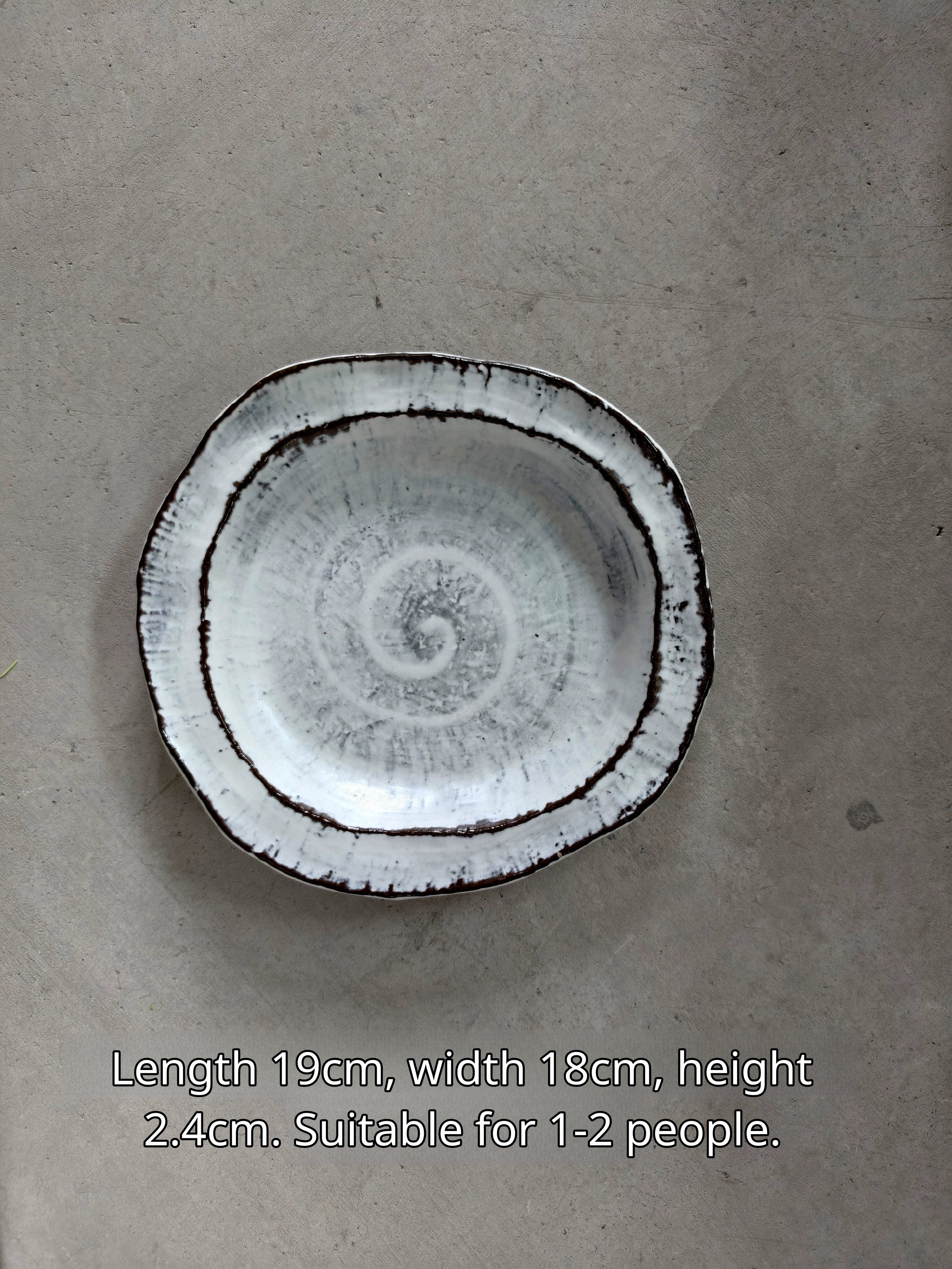 Oval ceramic plate in white with black rim and spiral, 19x18x2.4cm, for 1-2 servings, similar to Image 2.