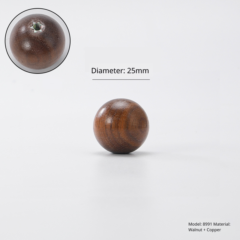 Small spherical walnut wood knob, diameter 25mm, model 8991, brass fitting. Top-down view shown.