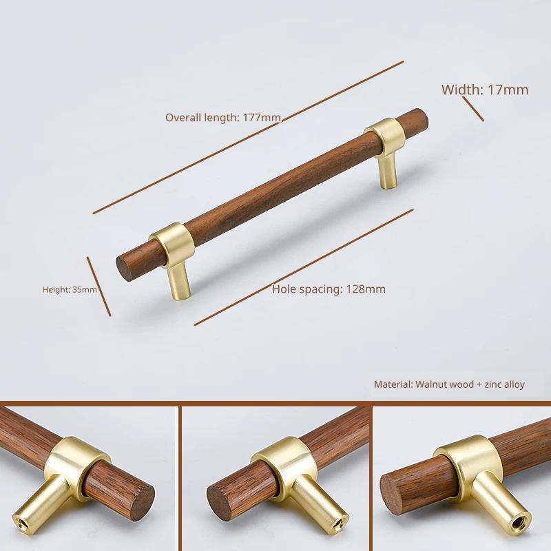 Walnut wood and brass handle, 177mm total length, 128mm hole spacing, 35mm height.