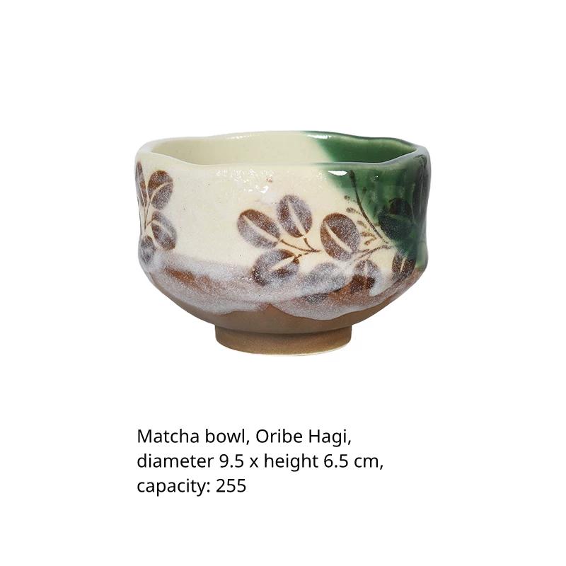 Matcha bowl with green leaf patterns, labeled '抹茶椀 織部萩' (Matcha Bowl Oribe Hagi).