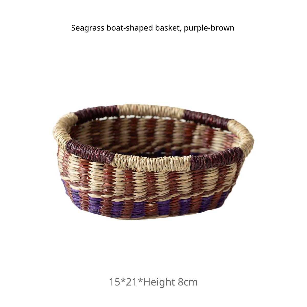 Seagrass boat-shaped small basket in a purple and brown weave, dimensions 15x21x8cm.