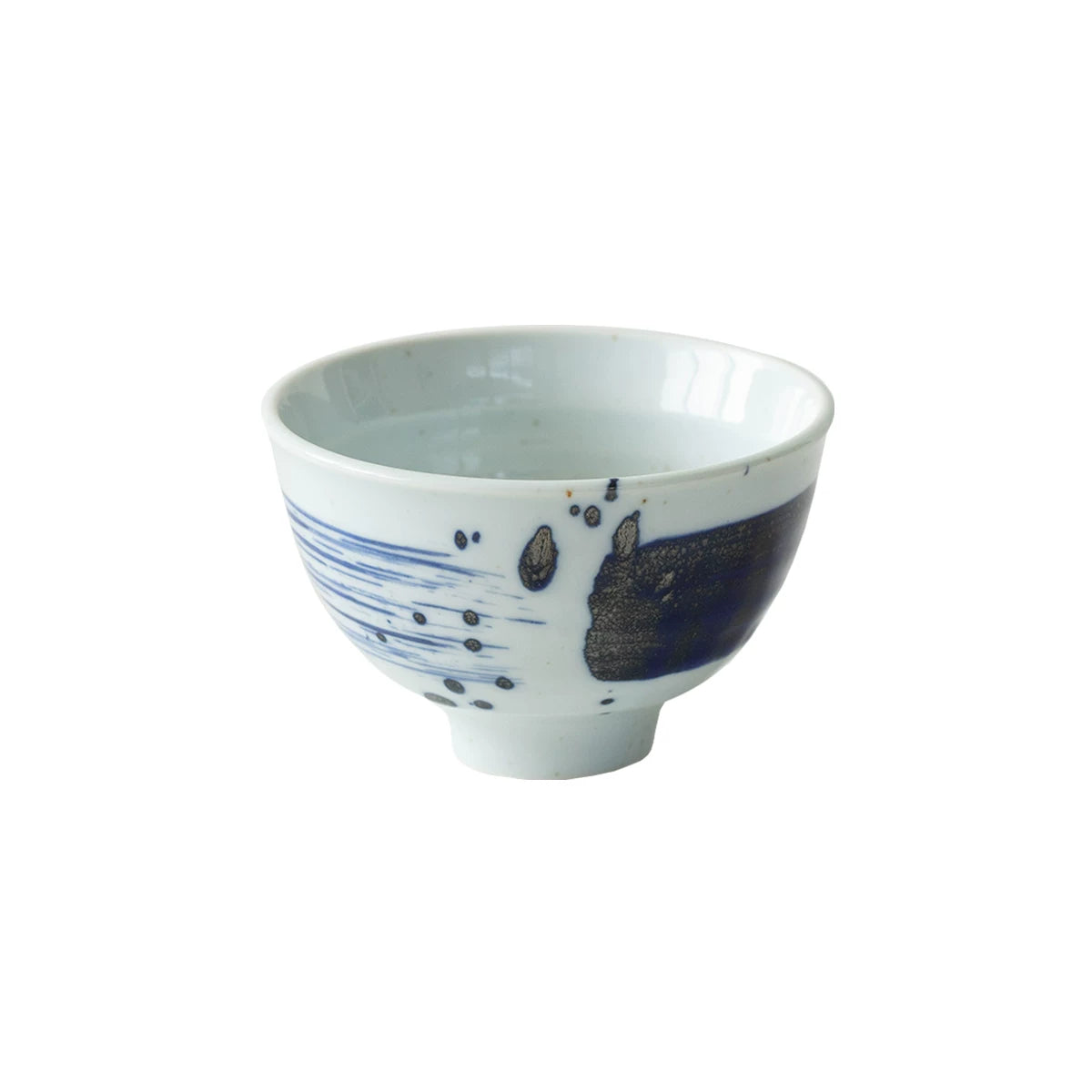 Single white ceramic rice bowl with dark blue, expressive brushstroke design, studio shot.