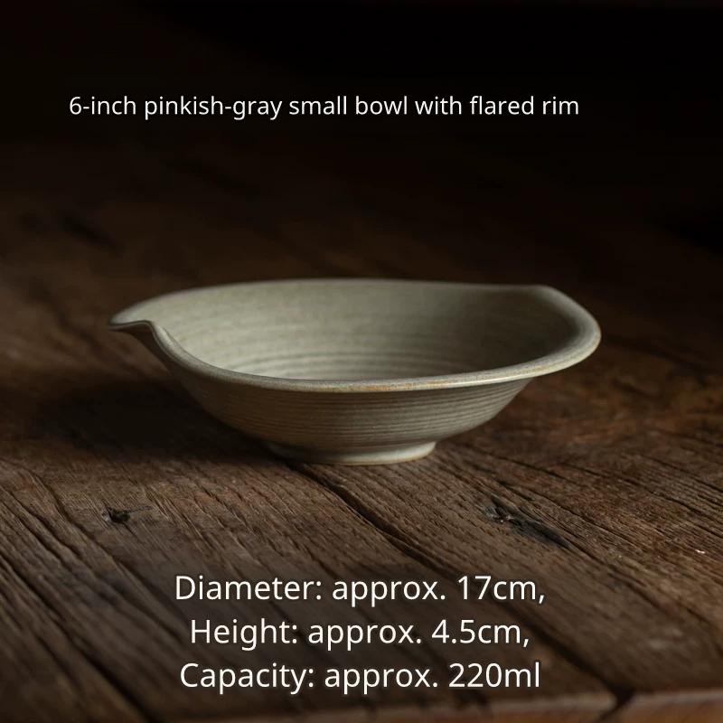 Medium 6.6-inch light grey ceramic saucer/shallow dish with a wavy rim and textured base.
