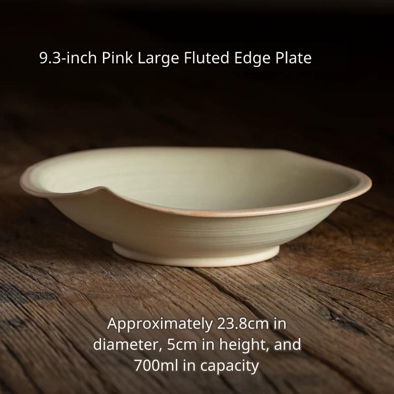 Large, light cream/rice colored ceramic shallow bowl with an uneven, flared rim, 23.8cm diameter.