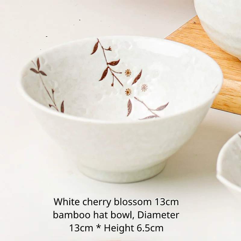 White ceramic noodle bowl with brown cherry blossom pattern, Chinese text describing size.
