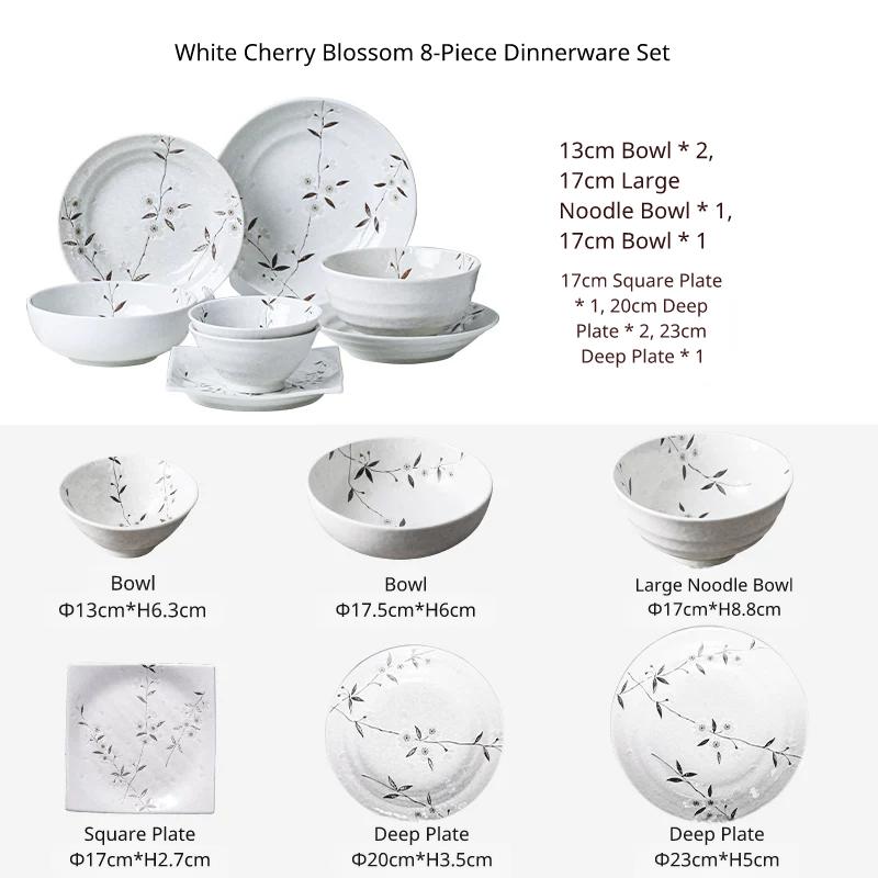 White ceramic 8-piece dinnerware set including bowls, plates, and deep dishes with cherry blossom design.