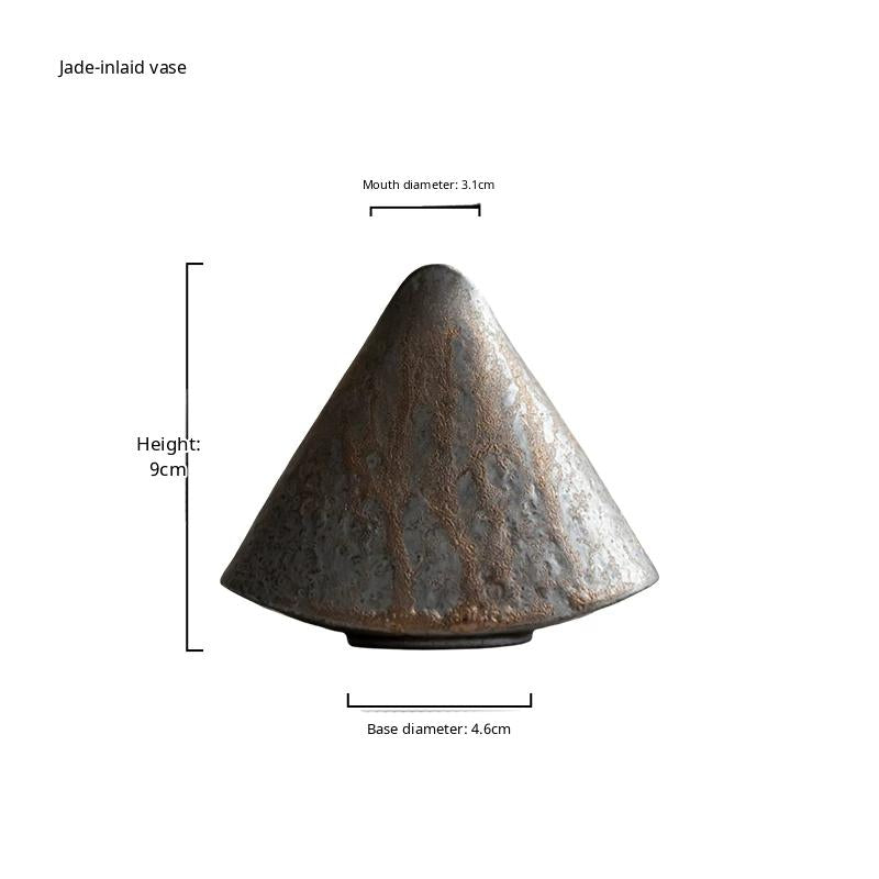 Handmade ceramic vase with a rustic stone texture and metallic micro-light glaze.