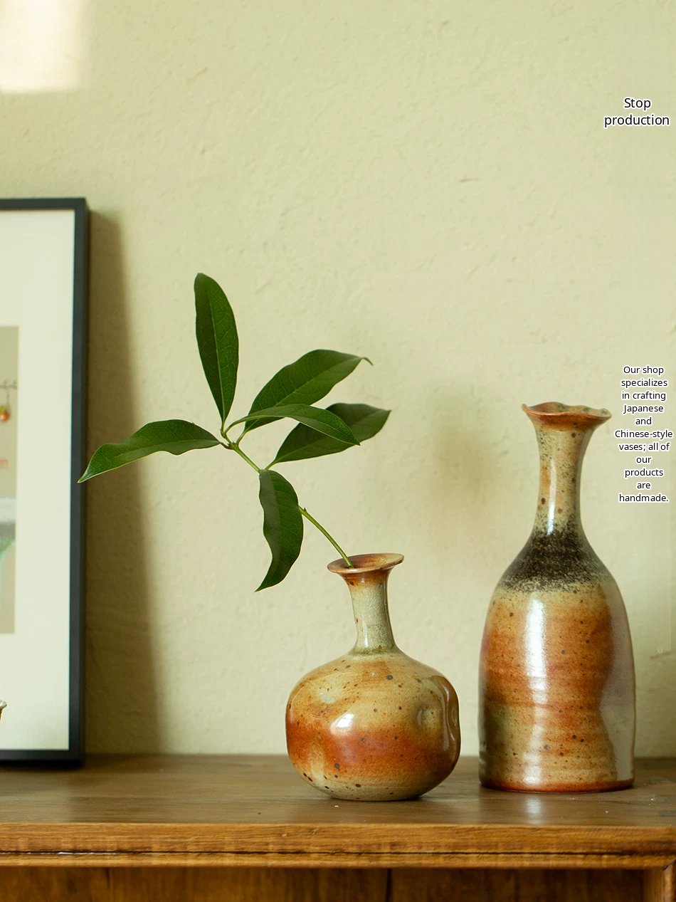 A handmade ceramic vase with a smooth, glossy green glaze and a minimalist silhouette.