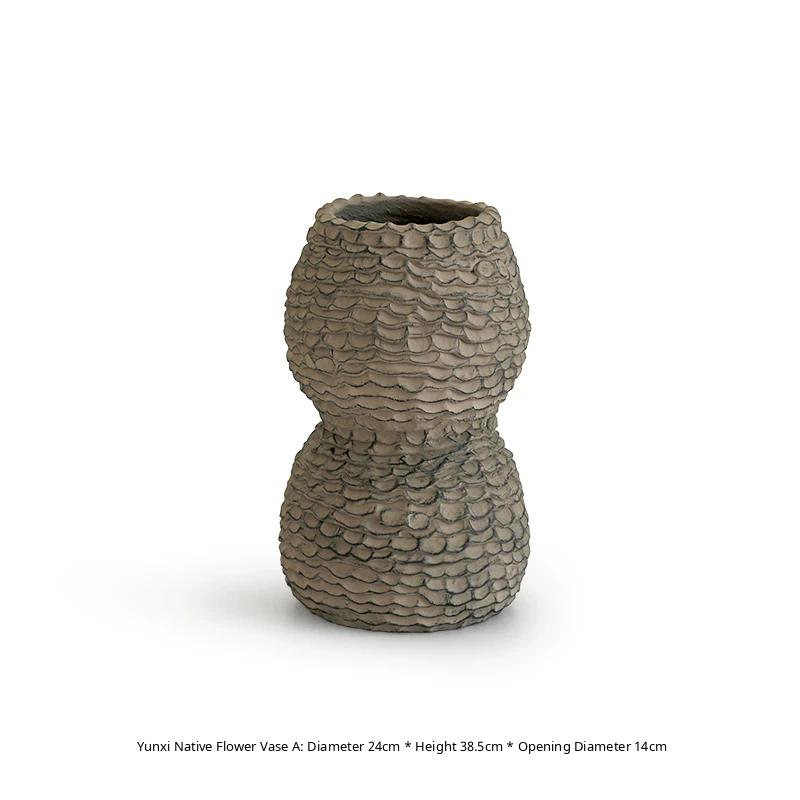 Handmade ceramic vase with a textured, rustic brown finish and a classic neck design.