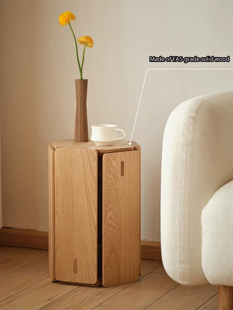 A minimalist solid wood stool with a geometric design, shown as a stackable seat or side table.