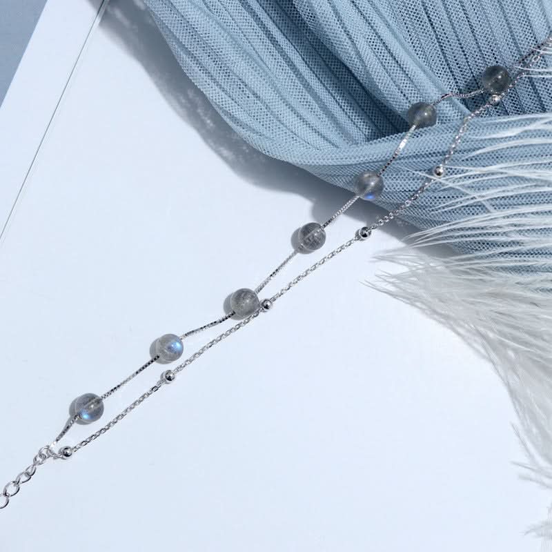 Delicate Moonstone bracelet s925 silver with shimmering grey beads on a delicate chain.