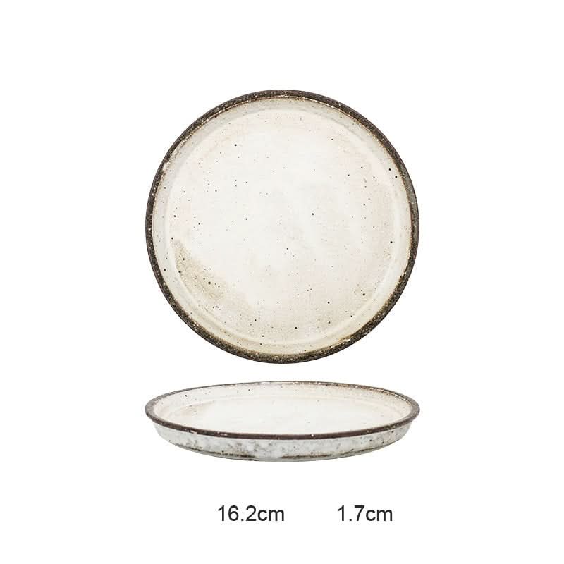 Clay ceramic white glazed dinnerware set, two rustic textured plates shown on white background.