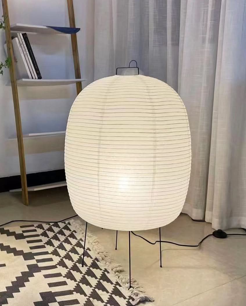 White spherical floor paper lamp 50x80cm, home decor, with black legs on patterned rug.