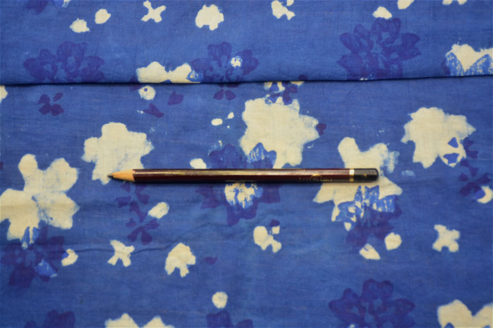 Natural indigo plant-dyed Indian fabric with floral pattern. Blue & white tablecloth.