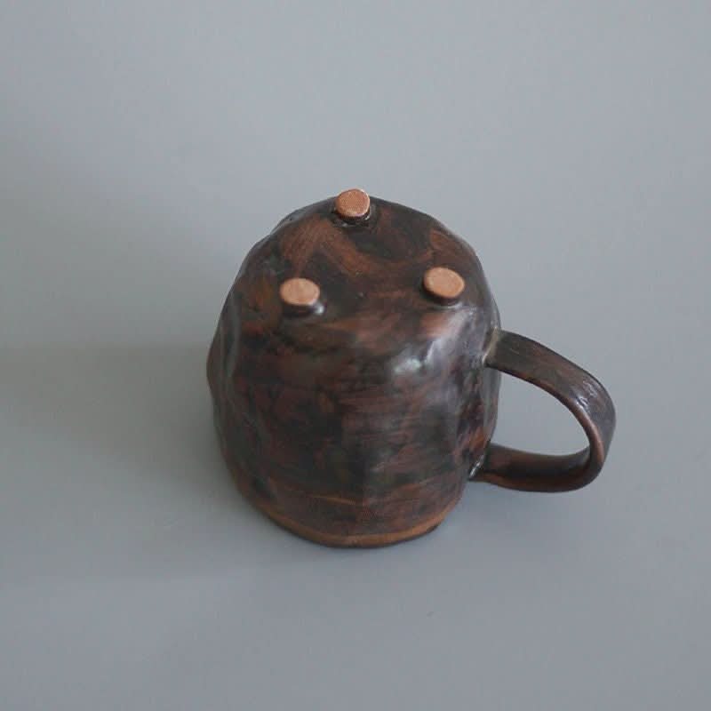 Rustic brown stoneware mug with copper-toned accents. 2X1 Stoneware Mug Set.