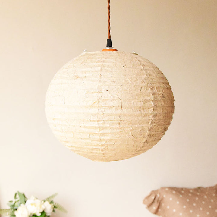 Round, cream-colored paper lantern shade, handmade.