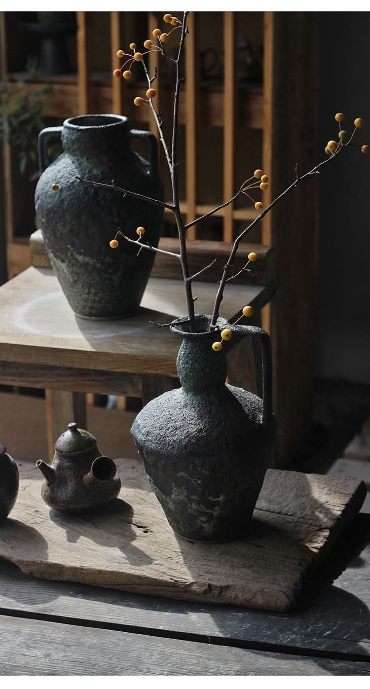 Wabi-sabi small ceramic vase with textured dark green finish and branches with yellow berries, home decor.