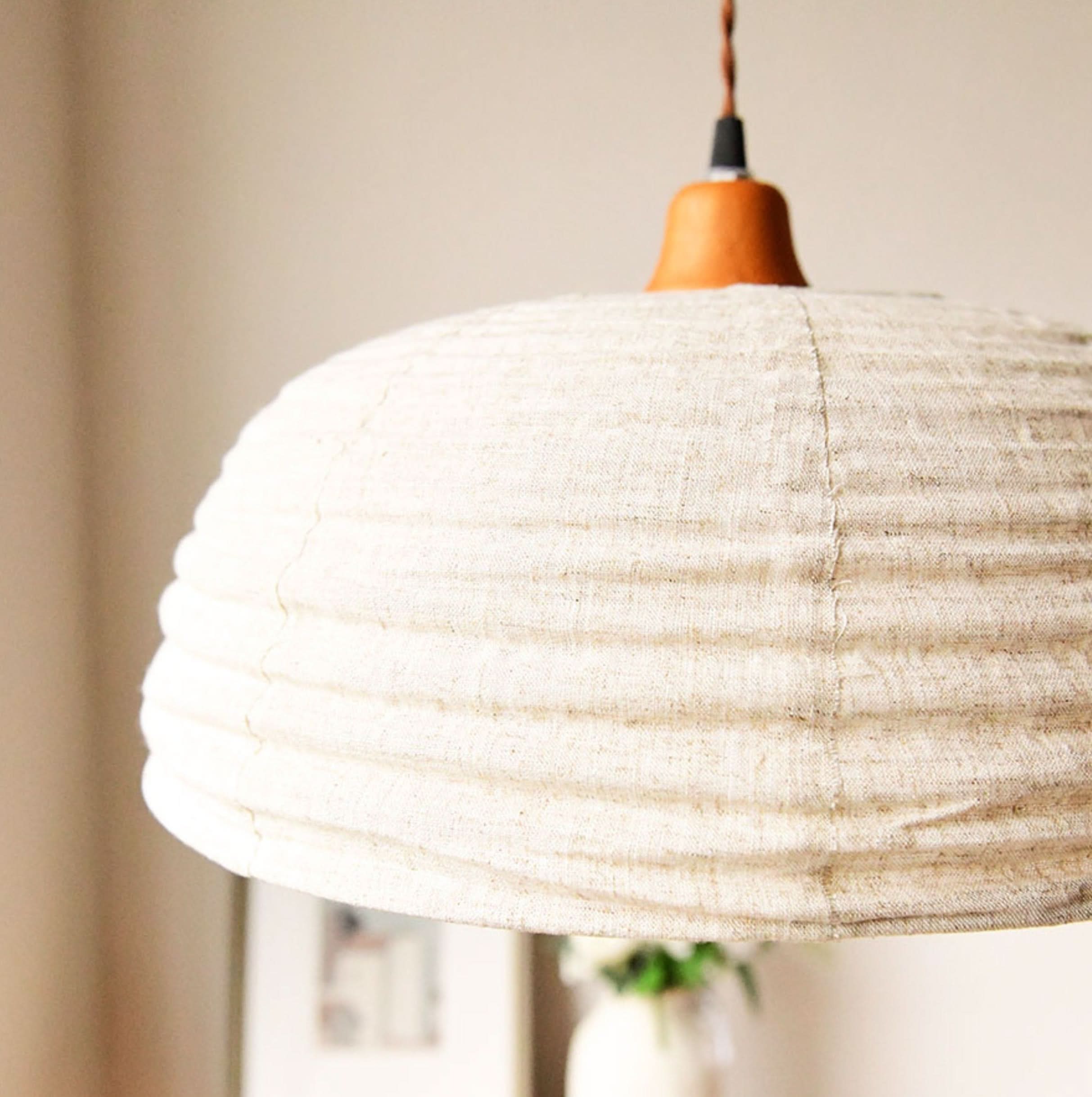 Dome lamp shade with natural hemp fabric and wood accent, home decor.