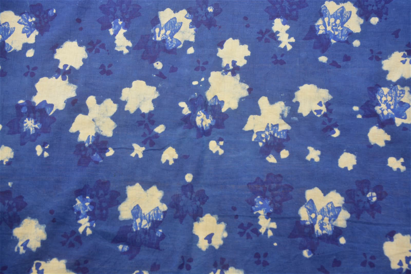Natural indigo fabric with white and blue floral pattern. Tablecloth, hanging cloth, decor.