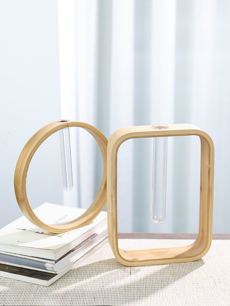 Wooden wall flower vase set with glass tubes on books, natural home decor.