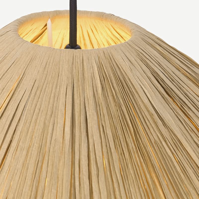 Natural raffia lampshade with a geometric design, warm interior glow. Home decor.
