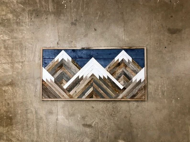 Boho Aztec Mountain Wood Wall Art: Rustic wood art with blue sky & white peaks.