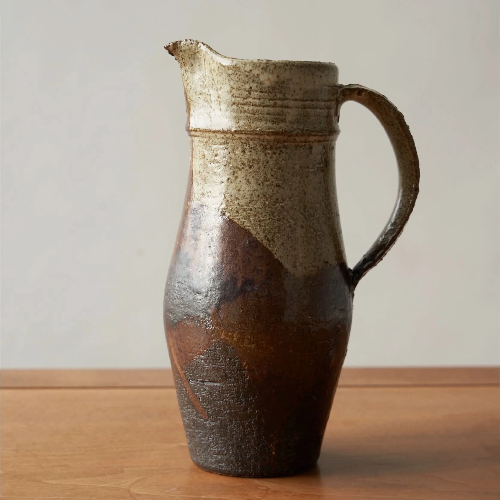 Rustic Ceramic Jug Rough Pottery Glaze in earthy tones, perfect home decor accent.