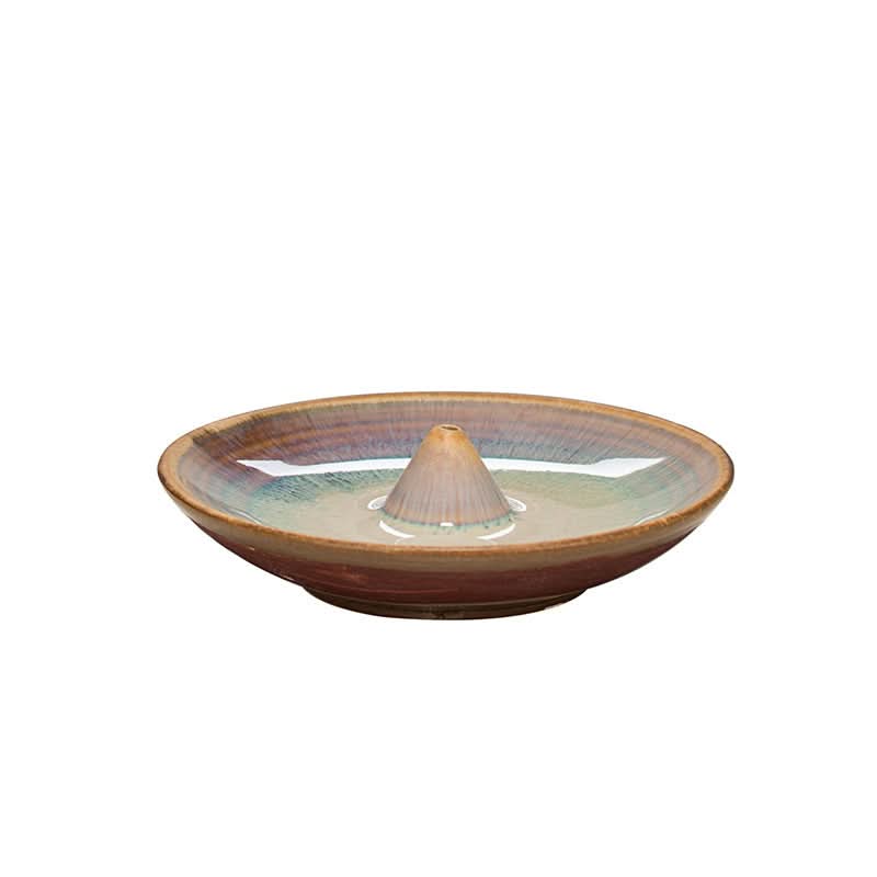 Glazed ceramic incense holder in earth tones, perfect for home decor.