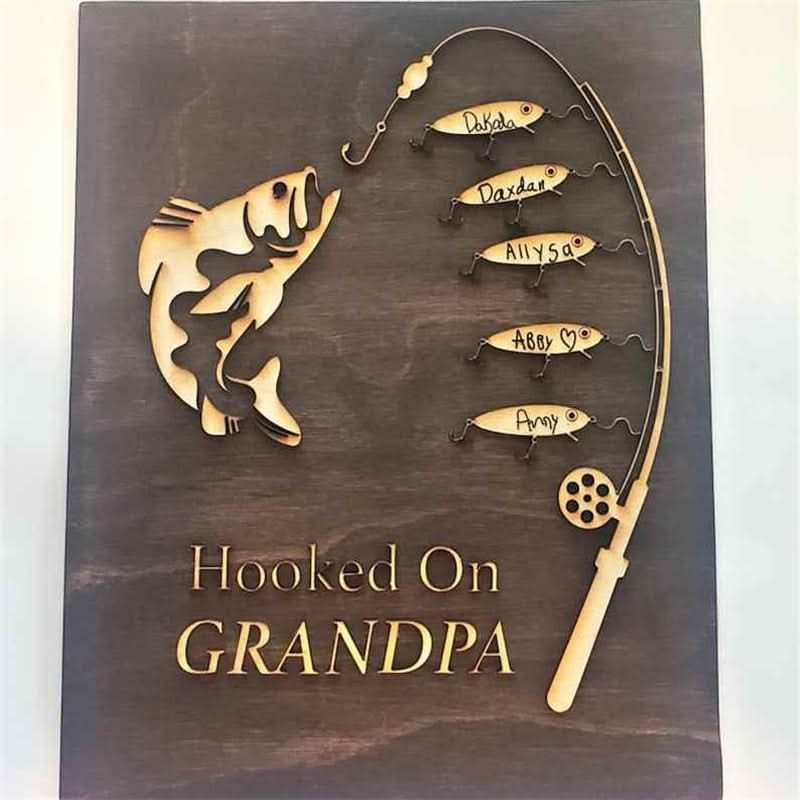 Personalized wooden wall art for Grandpa, featuring a fishing theme with engraved names.