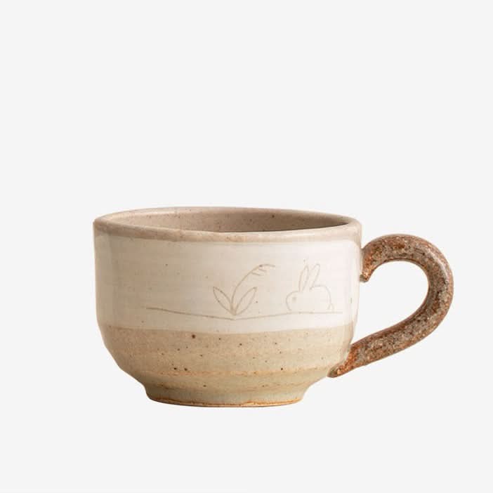 Stoneware Wangu Burning Rabbit Mug Made In Japan with nature-inspired artwork.