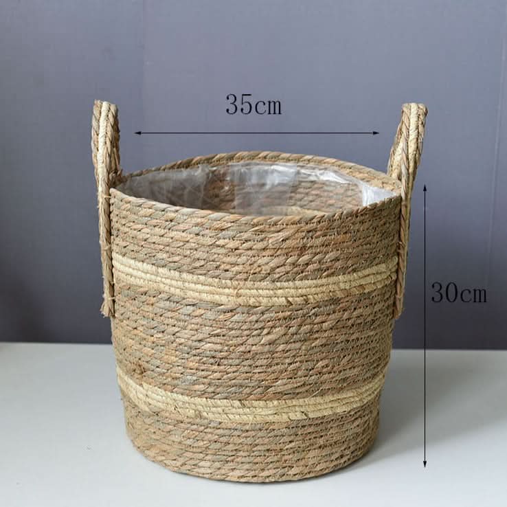 Natural woven plant basket with handles, beige and brown tones, 35cm wide, 30cm tall.