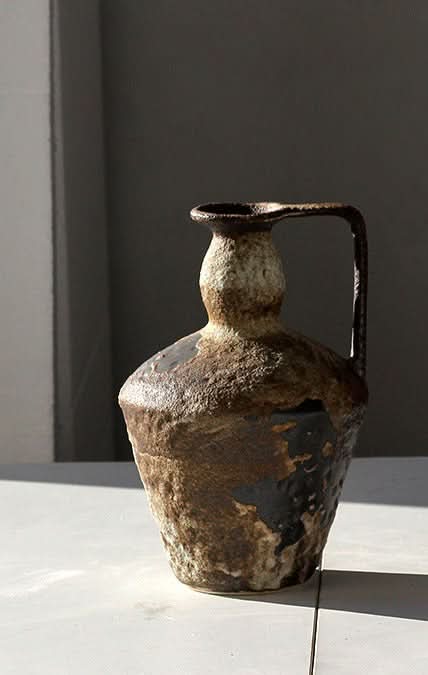 Textured brown and cream ceramic vase with handle, home decor.