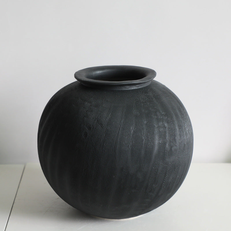 Black textured ceramic vase.