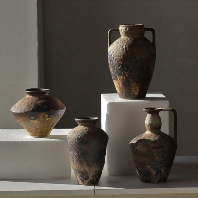 Rustic textured ceramic vases in earthy tones, perfect for home decor.