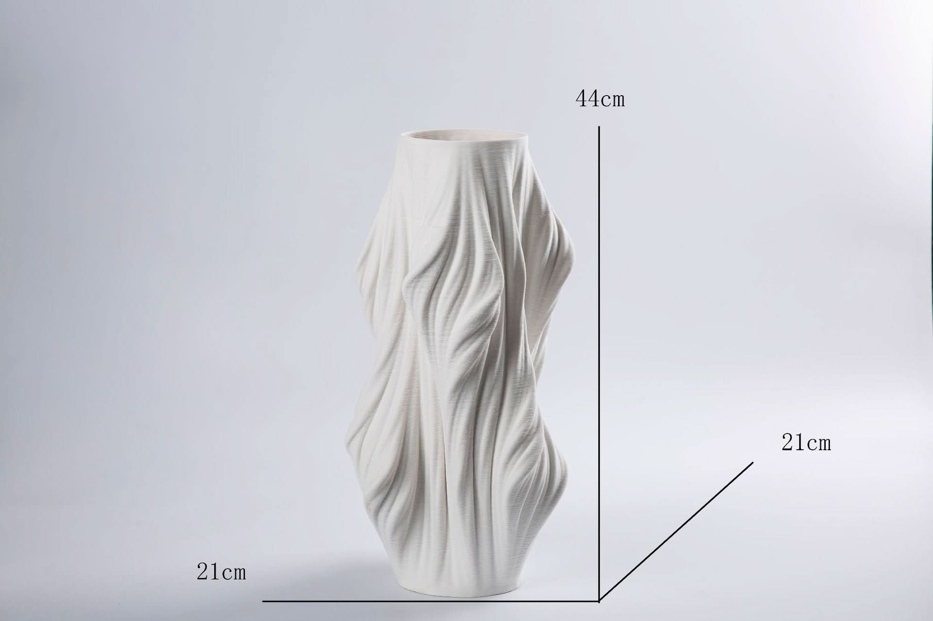 Cream 3D printed ceramic vase with flowing texture, perfect home decor accent.