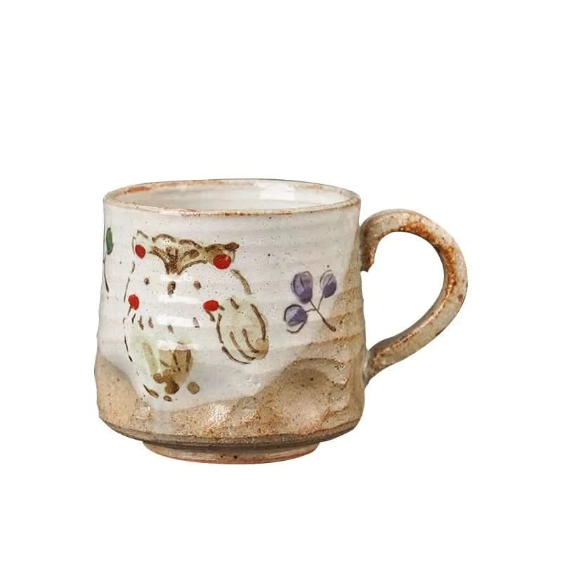 Creamy ceramic 11oz hand-painted coffee mug with owl design and rustic finish.