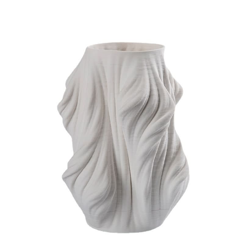 White 3D Printed Vase Made of Ceramic with flowing, sculpted texture.