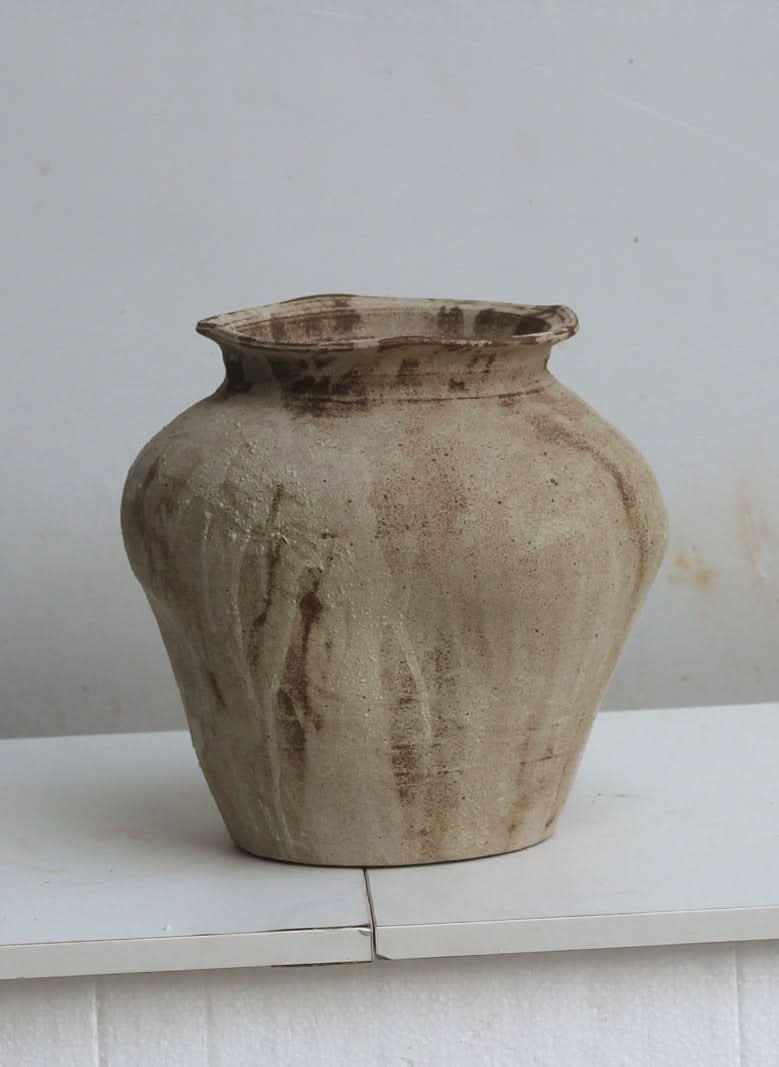 Neutral handmade ceramic vase with brown accents, home decor essential.