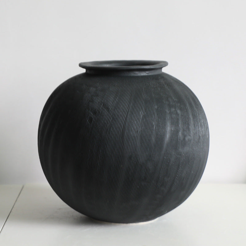 Black textured ceramic vase.