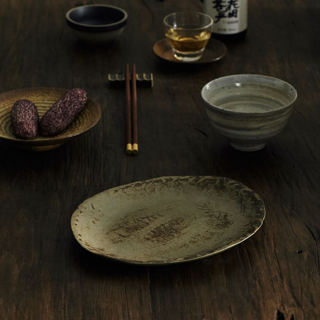 Unglazed ceramic plate with cloth texture, rustic earthenware, natural home decor setting