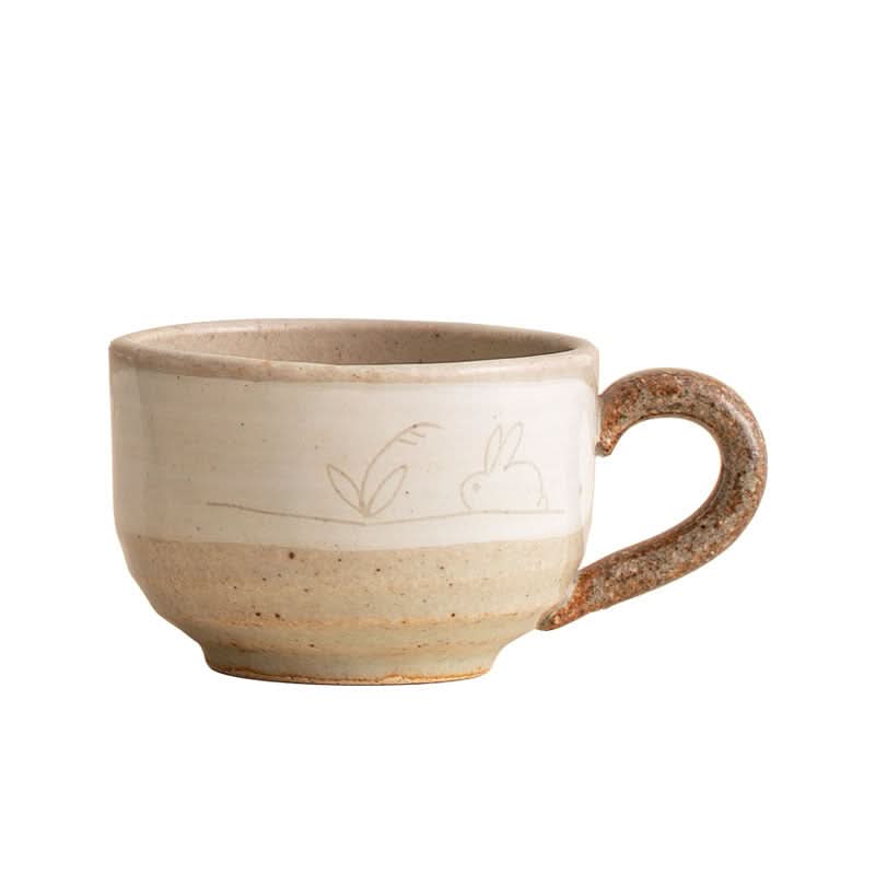 Stoneware Wangu Burning Rabbit Mug Made In Japan, cream & brown earthy tones, hand-drawn rabbit detail.